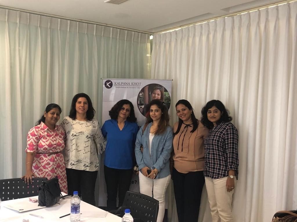 Kalpana Khot with a group of women at a coaching session