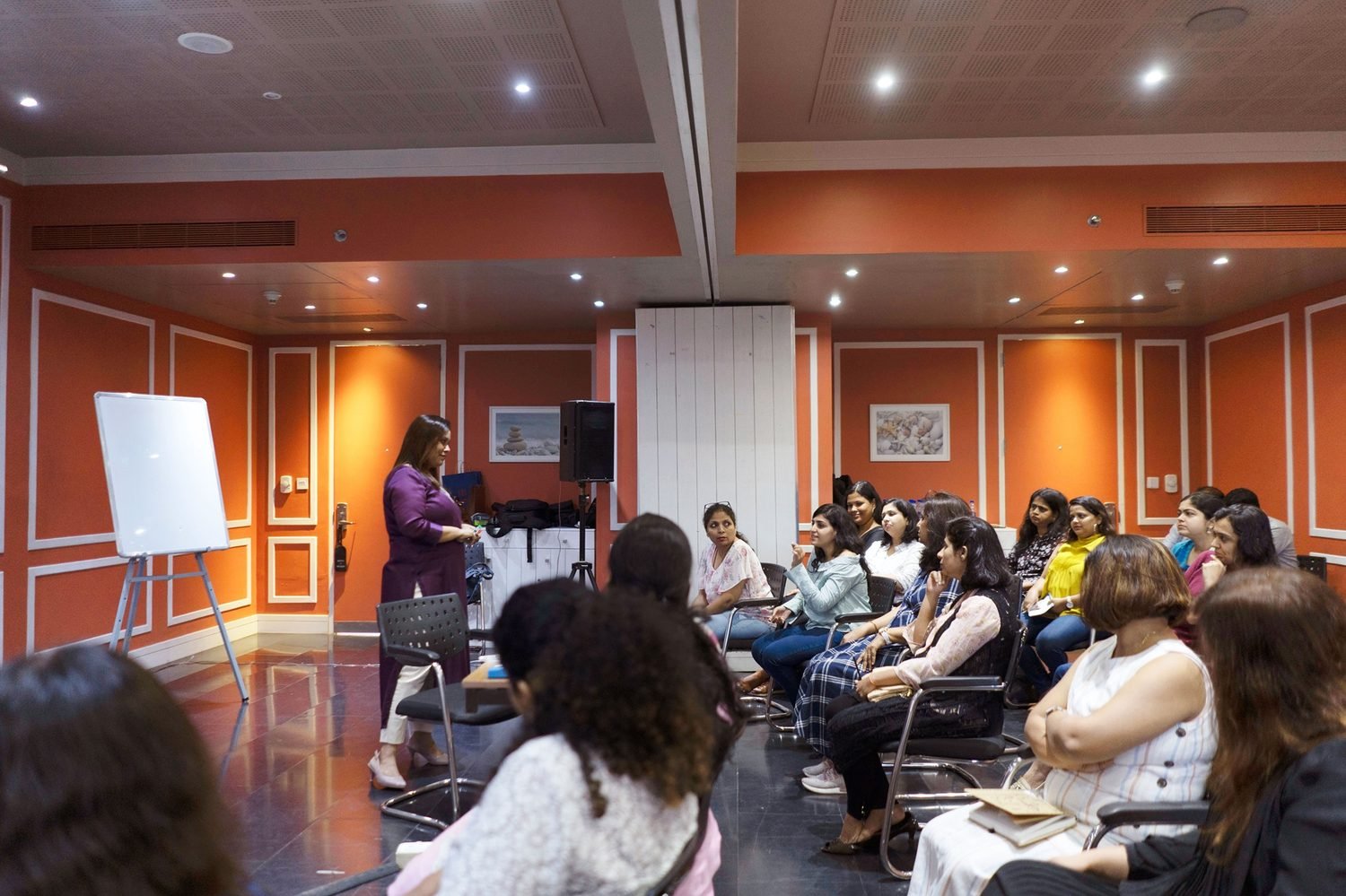 Kalpana Khot leading a workshop for a seated group
